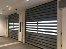 Aluminium Alloy Otomatisasi Industri Roll Up Door Kecepatan tinggi Spiral Door Efisiensi Keamanan Rintangan angin 2,0KNm2 Efisiensi Keamanan