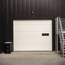 Dilapisi Steel Industrial Sectional Door Sandwich 40mm Slide Running Untuk Loading Dock